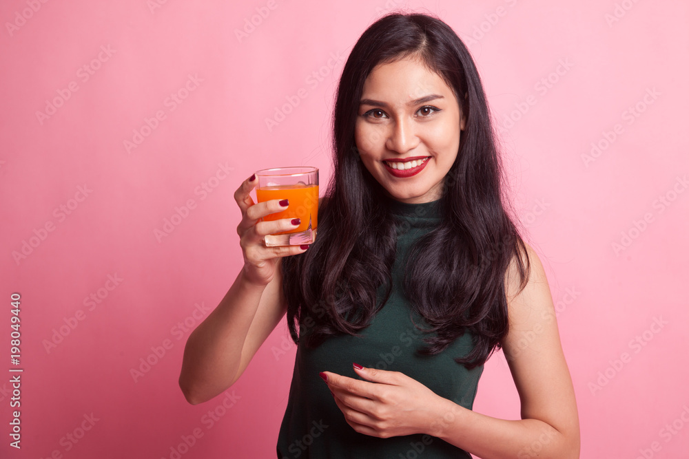 Young Asian woman drink orange juice. Young Asian woman drink orange juice.