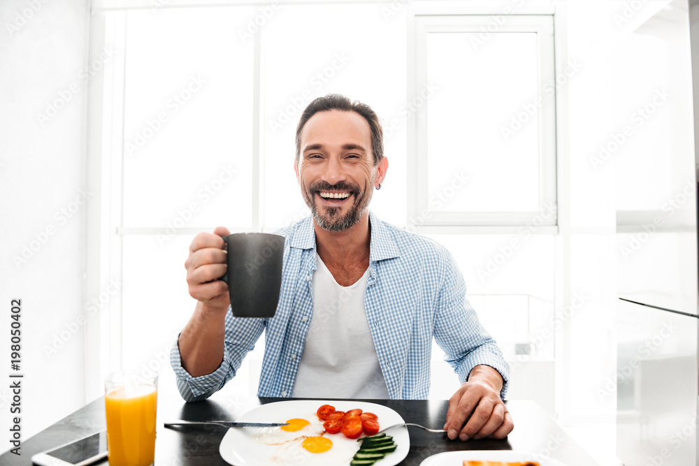 Satisfied mature man drinking coffee Satisfied mature man drinking coffee
