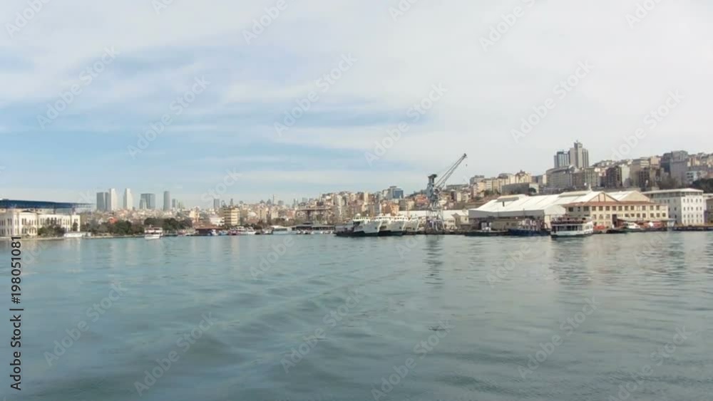 Panning shot. Beautiful view from sea to large modern city. Seaport Istanbul. Cruising in Bosphorus Panning shot. Beautiful view from sea to large modern city. Seaport Istanbul. Cruising in Bosphorus