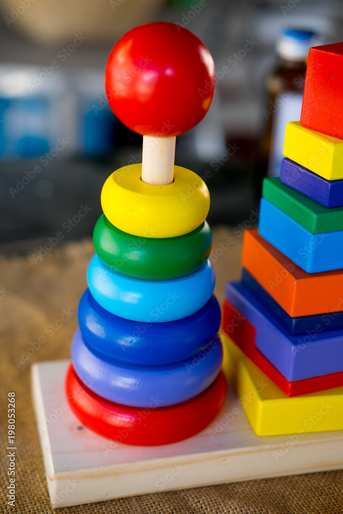 Toy for children pyramid with wooden rings Toy for children pyramid with wooden rings