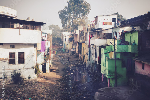 Grunge stone houses in poor area of historical indian town. photo