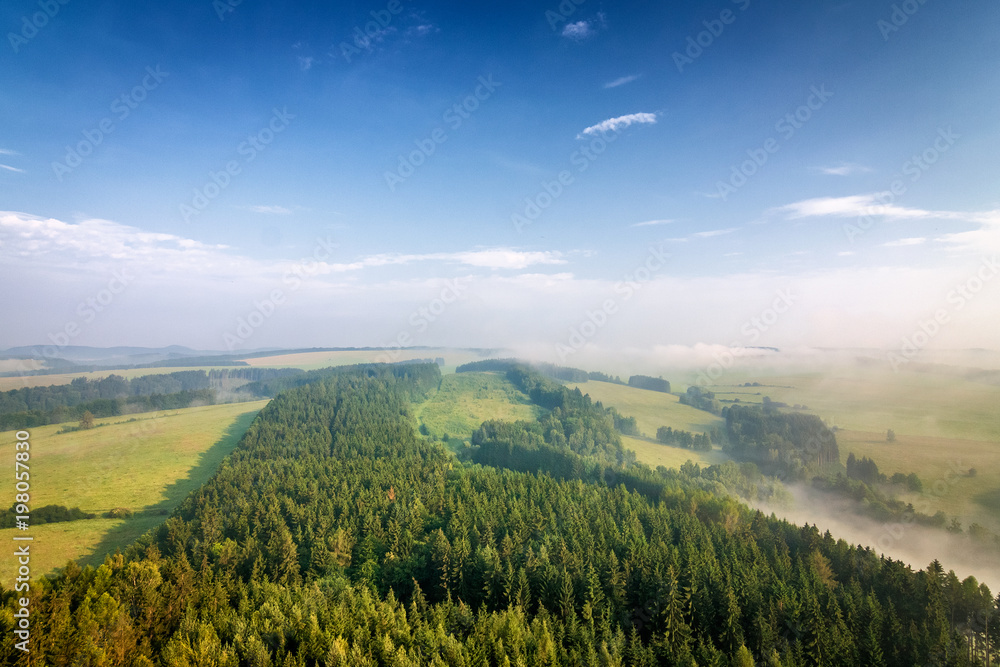 Morning hazy landscape under Cross Hill, Adrspach - Teplice rocks, Czech republic, Europe.