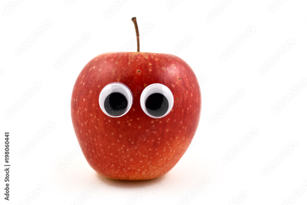 Funny red apple with googly eyes stock images. Cute apple with face