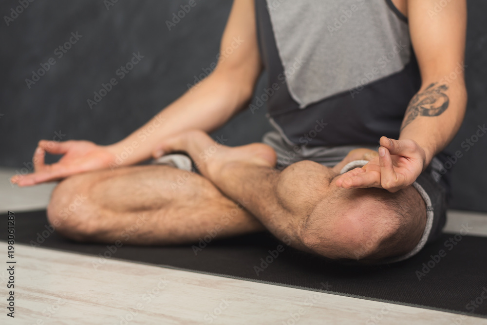 Young man practicing yoga, relax meditation pose