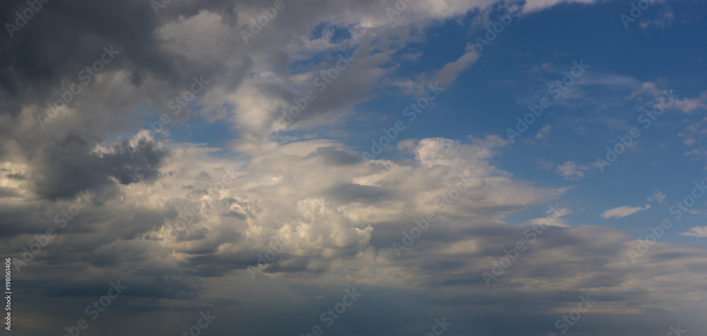 Obraz premium Landscape with dramatic light - beautiful golden sunset with saturated sky and clouds.