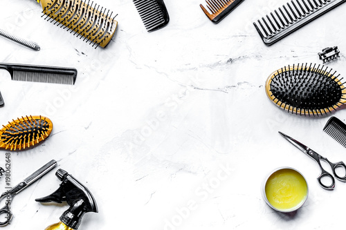 hairdresser working desk with tools on white background top view