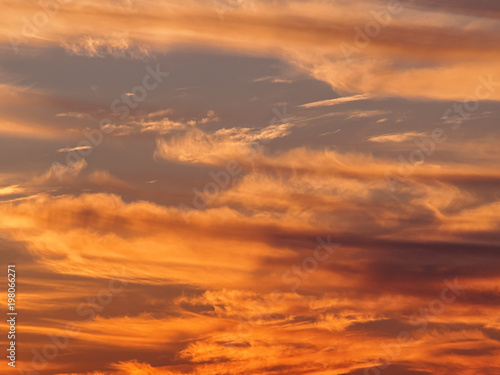 Real cloudy sky at sunset background © Belogorodov