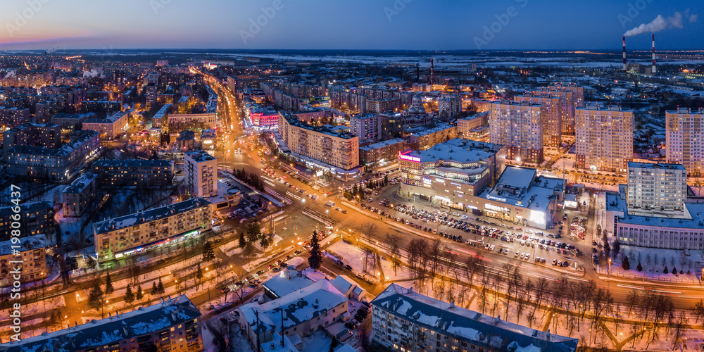 A view of city birds overlooking the street uses a photo of a drone at night, an image of a business concept