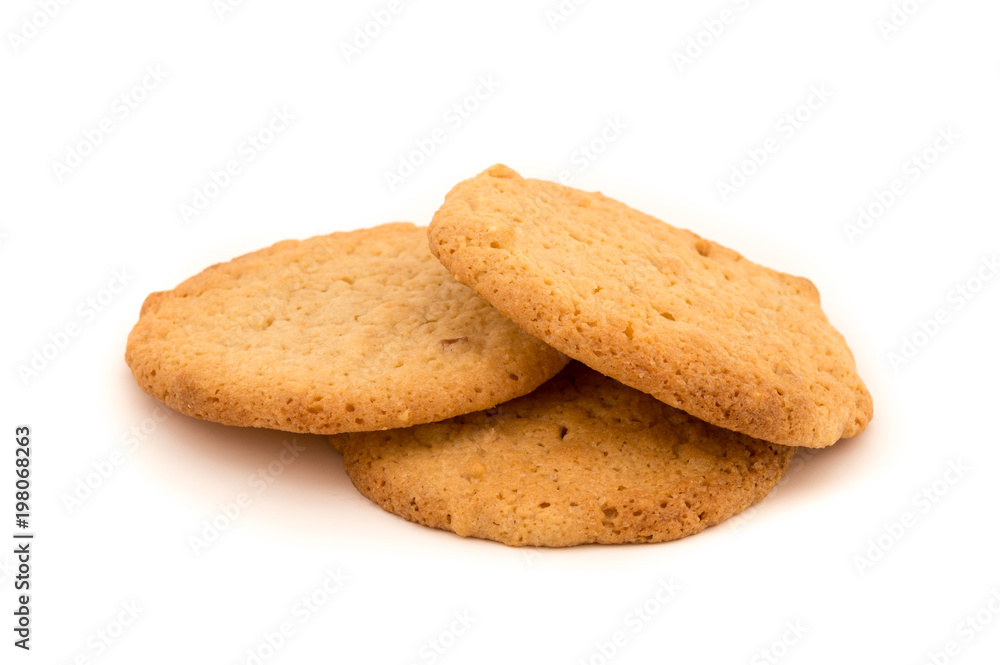 Three peanut butter cookies on a white background. Golden homemade biscuits fresh and reay to eat as a snack. Three peanut butter cookies on a white background. Golden homemade biscuits fresh and reay to eat as a snack.