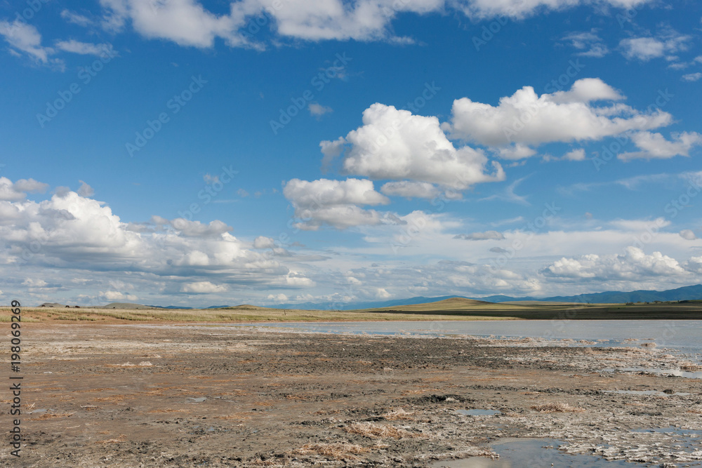 Landscape. Dried salt lake. Tyva. Steppe. Sunny summer day. Outdoors Landscape. Dried salt lake. Tyva. Steppe. Sunny summer day. Outdoors