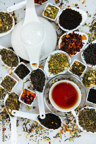 Assortment of dry tea. Various kinds of tea isolated on white.Different kinds of tea leaves. Tea composition with different kind of tea. Tea concept. Tea leaves photo