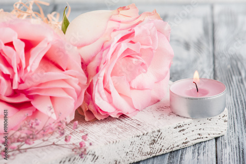 Pink gift box  roses  lit candle