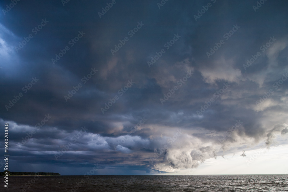 Storm clouds against the background of the sea..