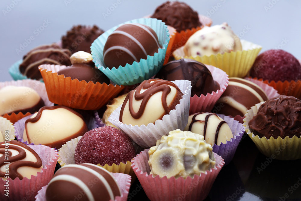 a lot of variety chocolate pralines, belgian confectionery gourmet chocolate. a lot of variety chocolate pralines, belgian confectionery gourmet chocolate.