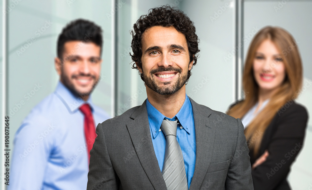Three businesspeople welcoming you Three businesspeople welcoming you