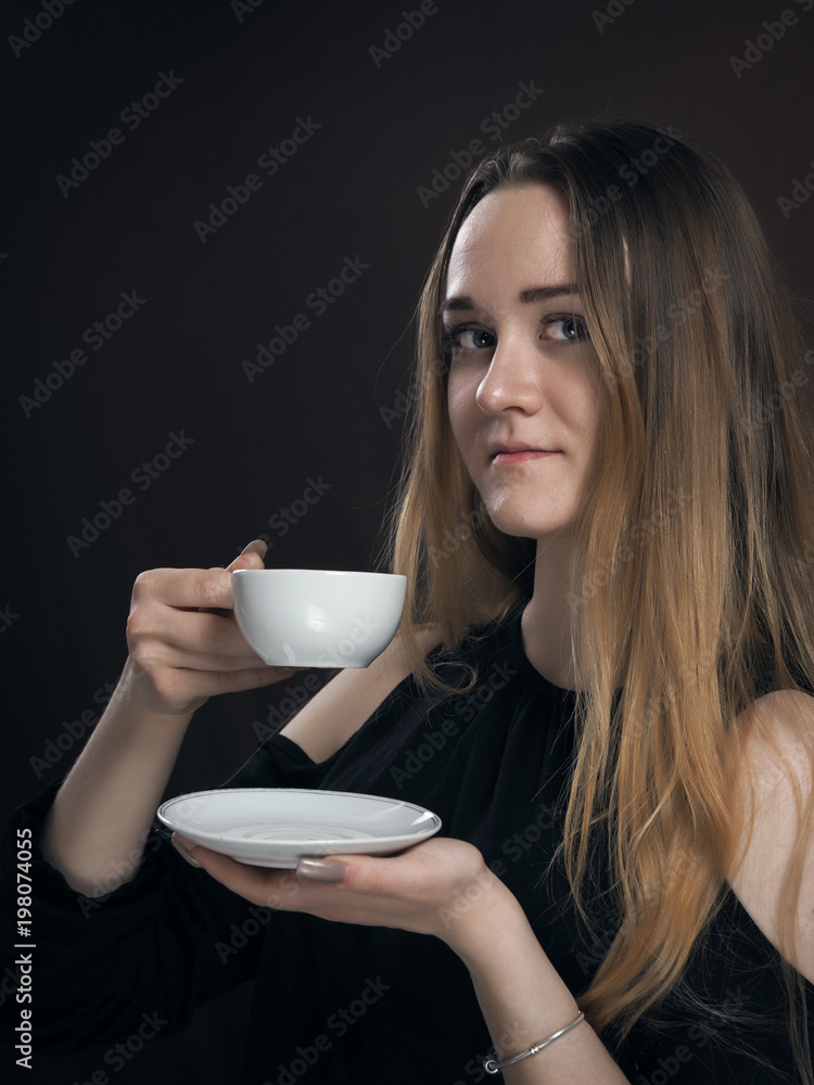Sensual portrait of a beautiful girl with a Cup of coffee or tea. Sensual portrait of a beautiful girl with a Cup of coffee or tea.