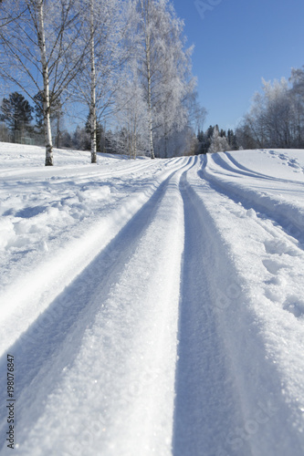Ski tracks on a sunny winter day.