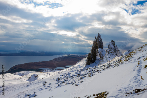 Old man of Storr with the Atlantic Ocean and the Landscape of the northern isle of Skye in the Background, Highlands Scotland