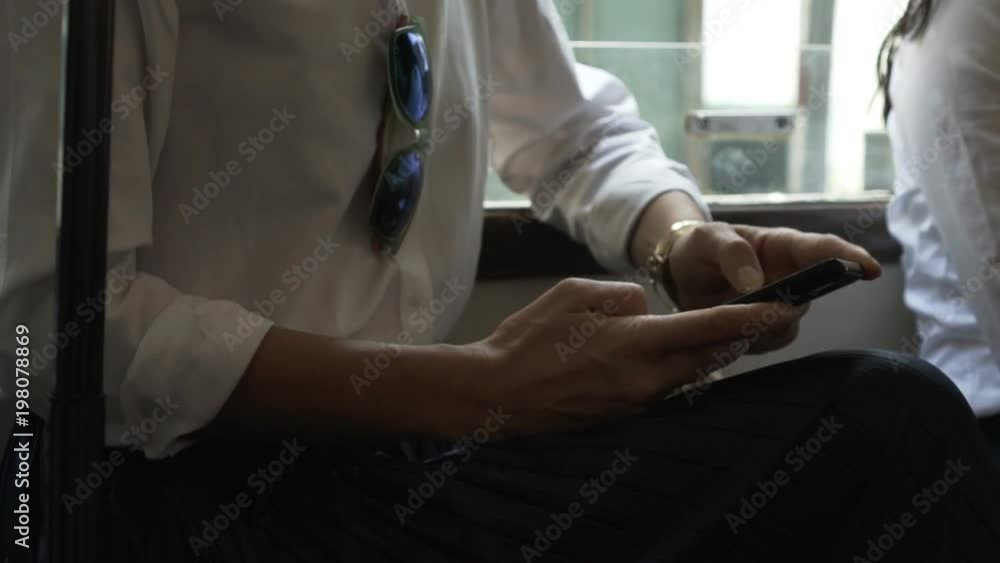 Businesswoman using smartphone while riding bus in city, super slow motion 120fps
Businesswoman using smartphone while riding bus in city, super slow motion 120fps