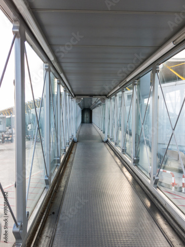 Vertical view of the airport bridge, where passengers connect with the plane. © Toniflap