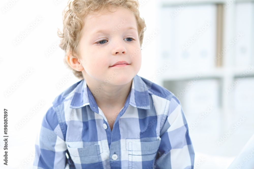 Doctor and child patient. Physician examines little boy by stethoscope. Medicine and children's therapy concept Doctor and child patient. Physician examines little boy by stethoscope. Medicine and children's therapy concept