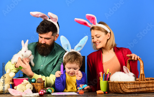 Easter egg, bunny ears - easter day concept. Cute child wearing bunny ears on Easter day.
