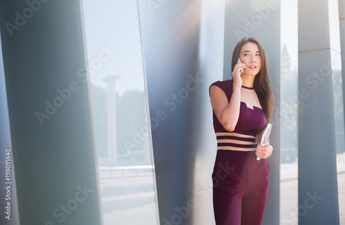Businesswoman talking on smartphone outdoors Free Download Businesswoman talking on smartphone outdoors - GFXLoad