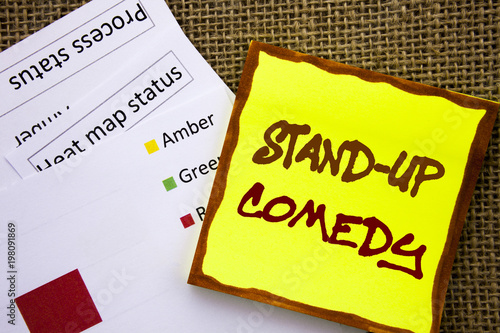 Handwritten text sign showing Stand Up Comedy. Business concept for Entertainment Club Fun Show Comedian Night written on Sticky Note Paper with Heat Map on textured background photo