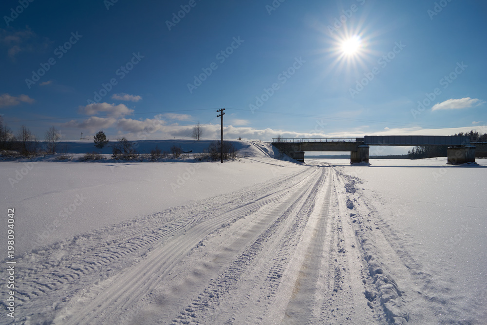 Ice road and railway bridge