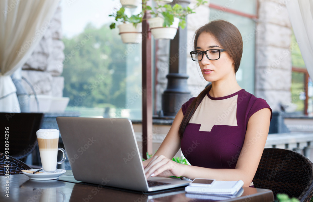 Young businesswoman outdoors working with laptop Young businesswoman outdoors working with laptop