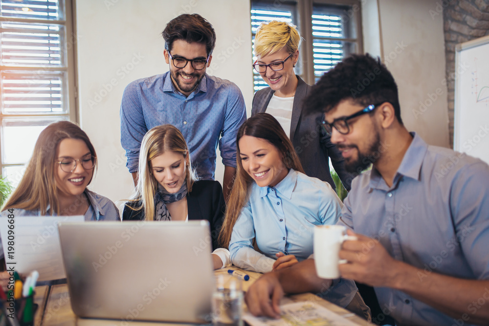 Group of young business people in smart casual wear working together in creative office Group of young business people in smart casual wear working together in creative office