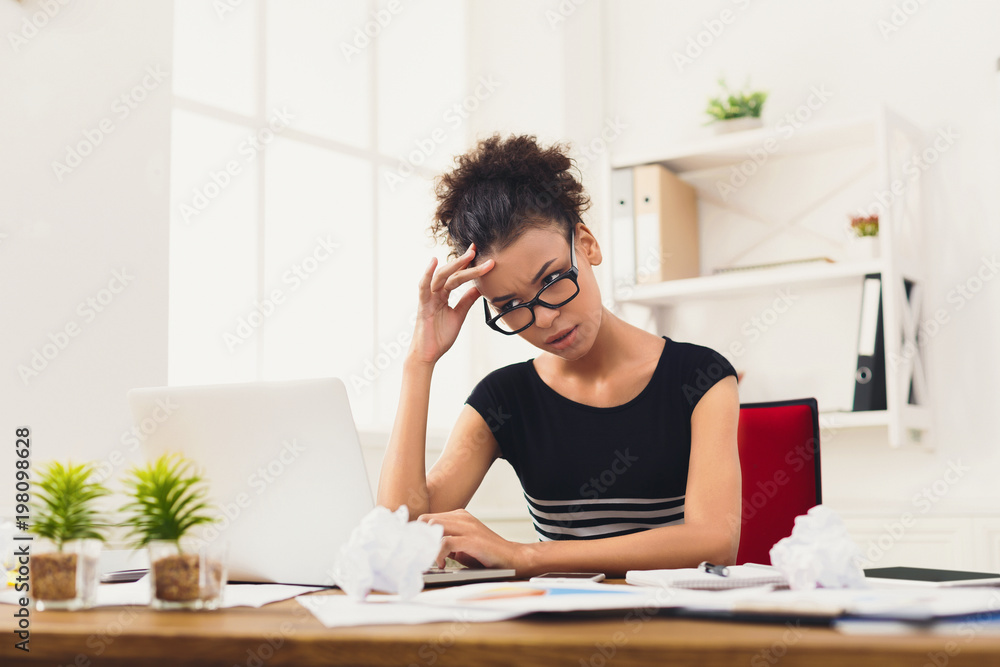 Frustrated business woman with headache at office Frustrated business woman with headache at office