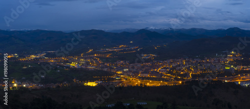 Lights at night in the city of Renteria between mountains, Basque Country, Spain