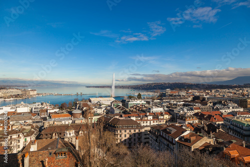 Geneva old city roofs and lake. Geneva aerial view from St. Pierre Cathedral bell tower. Winter day in Geneva, Switzerland.