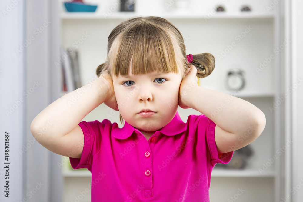 Cute little girl covering ears with hands Horizontal Cute little girl covering ears with hands Horizontal