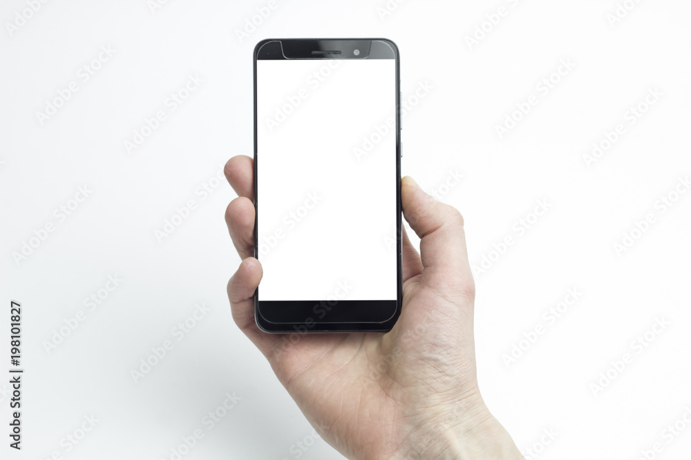 A man's hand holding a smartphone on a white background. Touching screen. A man's hand holding a smartphone on a white background. Touching screen.