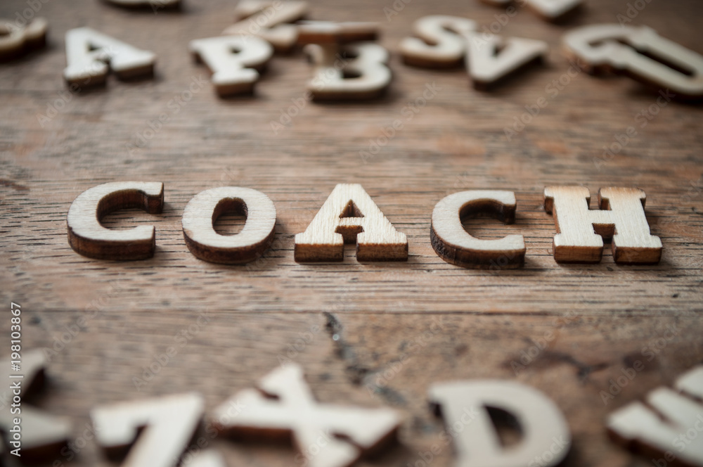 concept wooden letters on wooden table background - Coach concept wooden letters on wooden table background - Coach
