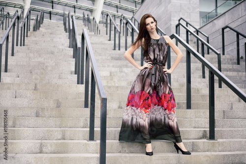 Photography Young beautiful girl with brown-haired woman in dress, walking down the street, the city and posing
