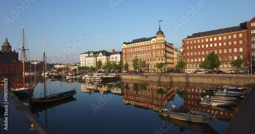 4K high quality aerial view drone footage of Helsinki Baltic Sea lagoon area, city skyline with vintage architecture and boats on summer morning, the capital of Finland Suomi, northern Europe