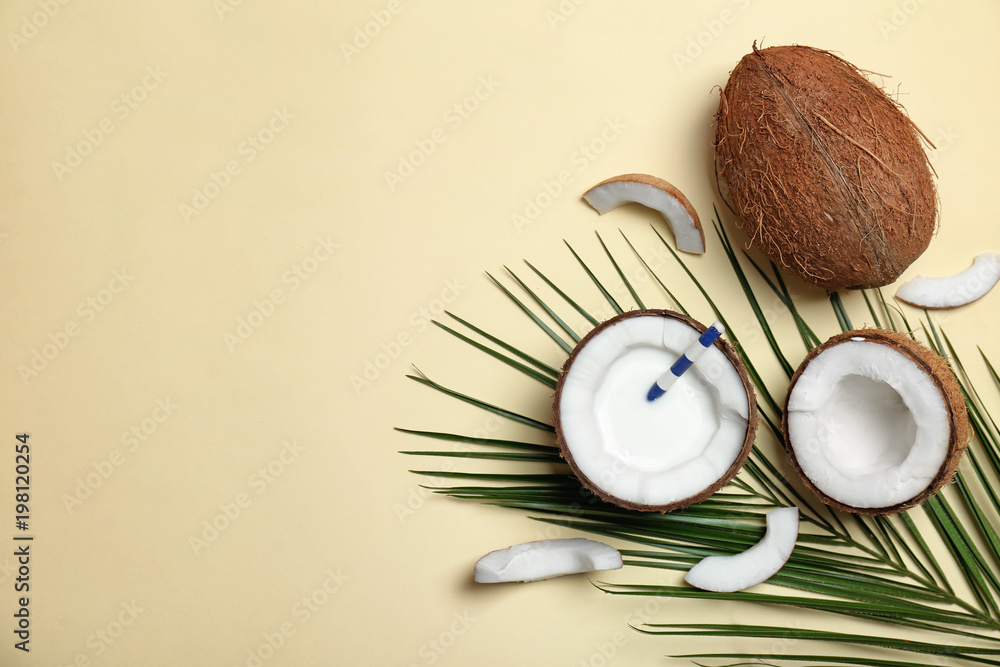 Composition with coconut milk and fresh nuts on color background, top view Composition with coconut milk and fresh nuts on color background, top view