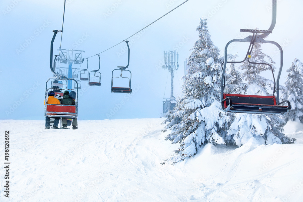 Ski lift at mountain resort. Winter vacation Ski lift at mountain resort. Winter vacation