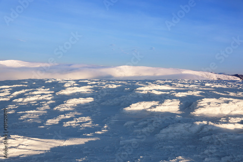 Beautiful snowy mountain peak on winter day