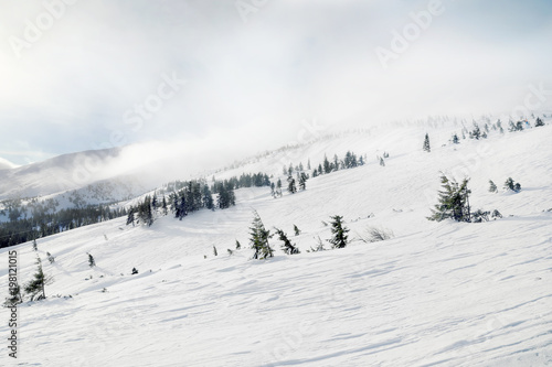 Ski slope at snowy resort on winter day © Africa Studio