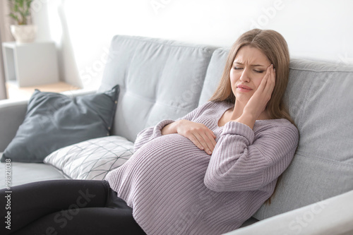 Young pregnant woman suffering from headache at home Free Download Young pregnant woman suffering from headache at home - GFXLoad