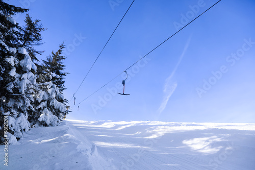 Ski lift at snowy resort. Winter vacation