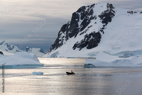 Zodiac cruising through icebergs, Antarctica © David