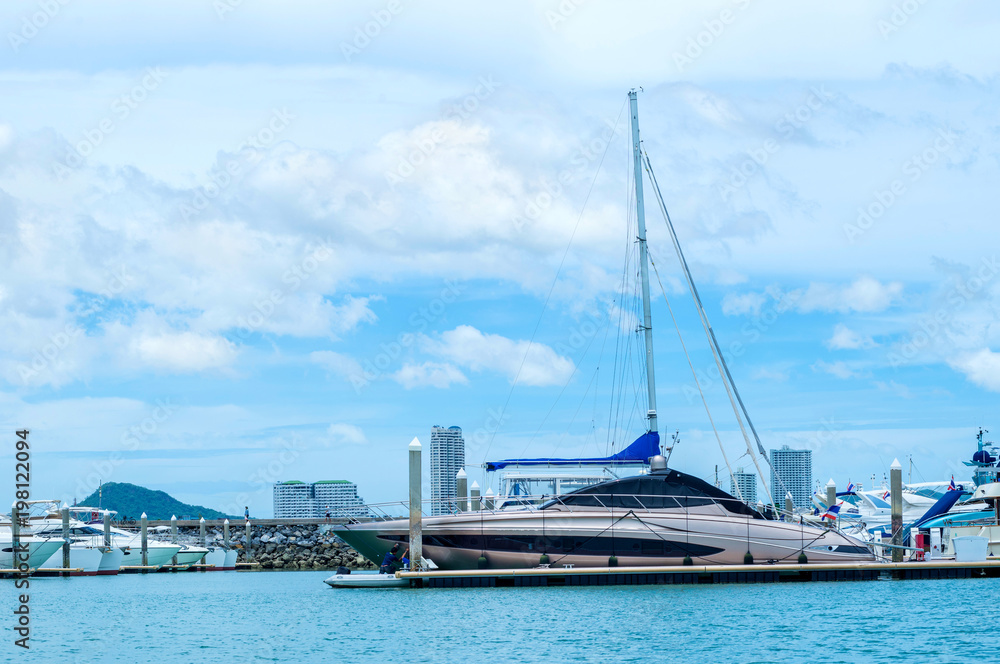 A luxury yacht docked in the parking of boats and yachts in Ocean Marina at Pattaya, Thailand A luxury yacht docked in the parking of boats and yachts in Ocean Marina at Pattaya, Thailand