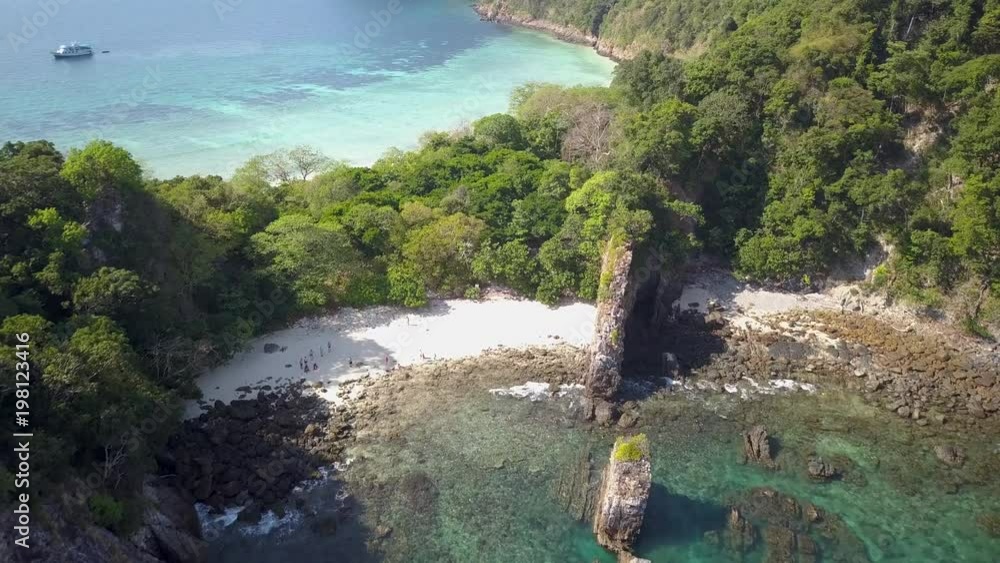 4k aerial drone view of a narrow tree covered tropical island in the Mergui Archipelago, Myanmar (Burma) 4k aerial drone view of a narrow tree covered tropical island in the Mergui Archipelago, Myanmar (Burma)