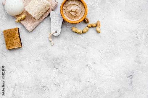 organic scrub with peanut for homemade spa on stone background top view mockup