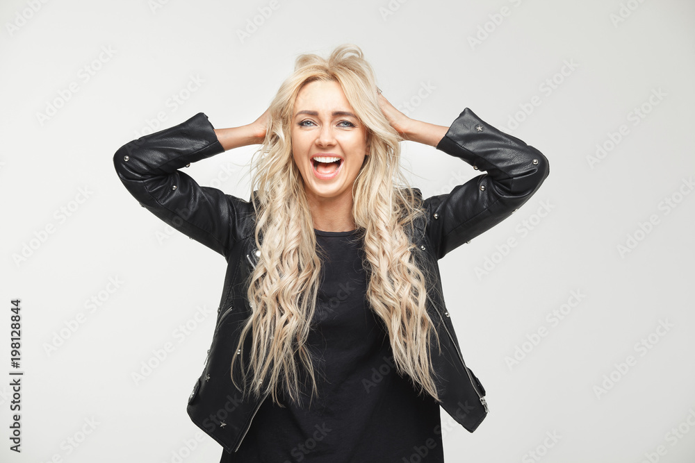 scared woman in a panic grabbed his head and screams in fear, his mouth wide open and eyes. stress, annoyance, shock. scared woman in a panic grabbed his head and screams in fear, his mouth wide open and eyes. stress, annoyance, shock.